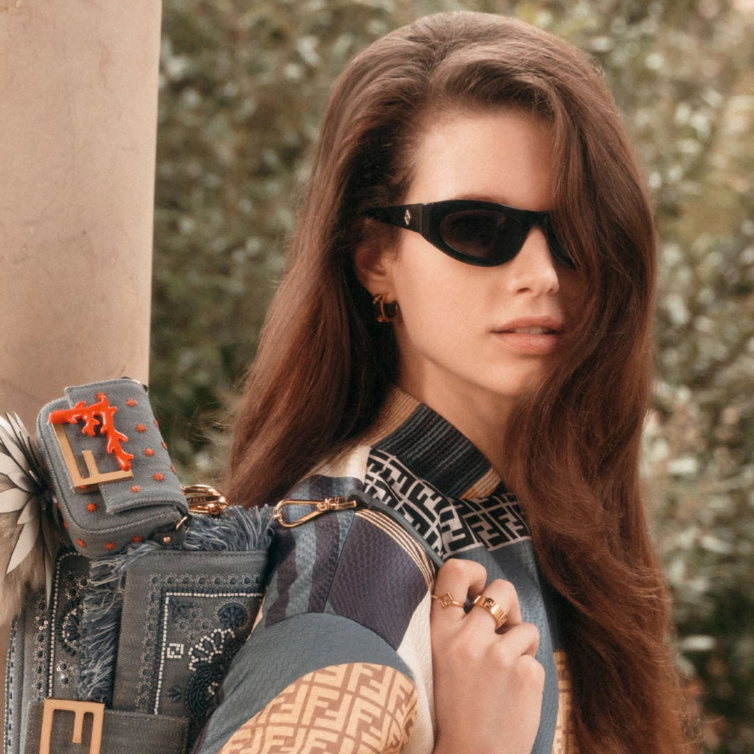 A model displaying the playful and luxurious style of FENDI sunglasses.